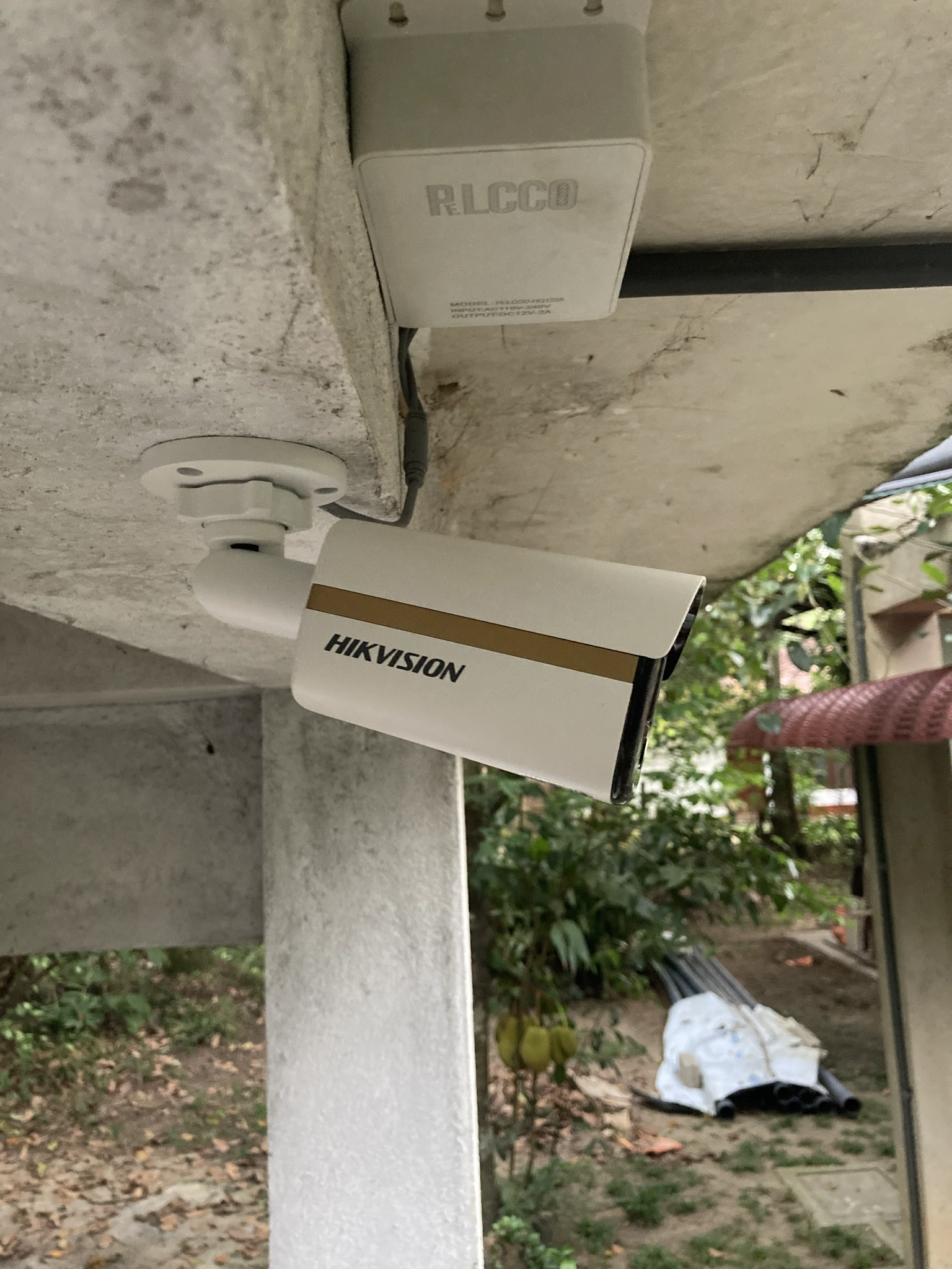Hikvision bullet camera mounted under concrete beam at Hapugala property