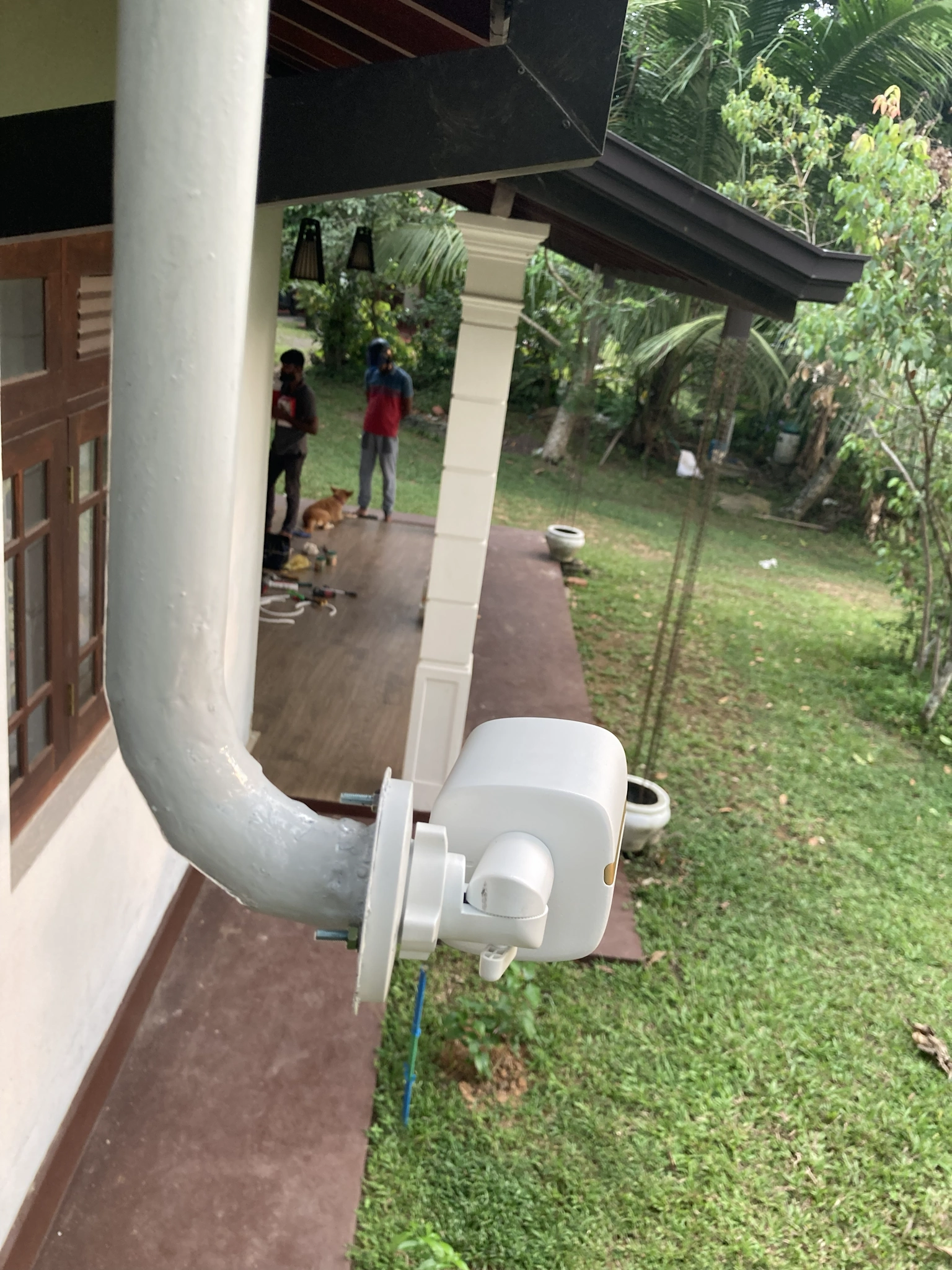 US Layer technicians installing Hikvision camera on wall corner at Hapugala